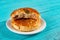 Sesame seed cakes with some bites on blue background