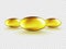 Set of 3 Liquid Gel Gold Oval Oil bubble isolated on transparent background. Cosmetic Capsule of vitamin E, A or omega 3 or 6 oil