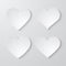 Set of 4 white paper cut out hearts different shapes