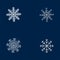 Set of 4 white snowflakes. White snowflakes on navy blue background.