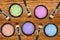 Set of 5 eyeshadows and brushes over wooden texture close-up