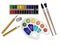 Set of art materials, stationery, watercolor paints and brushes, a palette of paints, an eraser and pencils.