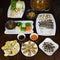 Set of Asia sea food with Coconut Escargot, barbecue razor clam, cheese grilled oyster, boiled vegetable eating with braided fish