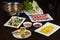 Set of Asian food with Fried Crispy Potato, Barbecue geoduck with onion and grease, Shrimp stir-fried vermicelli, hot pot with raw