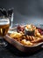 Set of assorted beer snacks - sausages, chicken wings, croutons, onion rings and squid rings on wooden board with sauce and glass