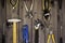 Set of assorted work carpentry and locksmith tools on a dark wooden background with copy space