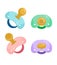 Set of baby pacifiers on white background.