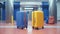 set of baggage bags in airport, colorful luggage cases, travel and vacations concept, flight journey destinations