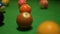 Set of balls with numbers lies on modern green pool table