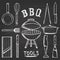 Set of barbecue tools drawn in chalk on a blackboard. Hot brazier, grater to peel, blender, frying pan, tongs, knife, slicer.