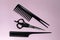 Set of barber accessories. Stylists scissors and combs. Hairdresser. Pink background