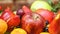 Set of berries and fruits in wooden box. Apple, strawberry, grape, berry and peach.