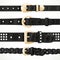 Set of black buttoned to buckle belts