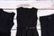 Set of black garment for school girls.