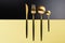 Set of black and gold cutlery