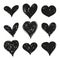 Set of black grunge hearts.