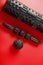 Set of Black lumpy foam massage roller, body roller, rubber ball on red background