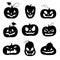 Set of black silhouettes of carved pumpkins for Halloween