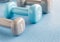 Set of blue and grey dumbbells, close up