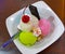 Set of bowls with various colorful Ice Cream scoops with different flavors and fresh ingredients, chocolate, vanilla, and