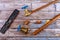 Set of brass plumbing fitting tools on wooden board