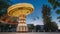 Set. Brightly Illuminated Rotating High Speed Carousel Merry-Go-Round. Summer Evening Night In City Amusement Park