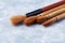 Set of brushes Fude for Sumi-e painting. Bright wooden background. Close up