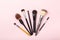 Set of brushes for make up on pink background. Women`s secrets