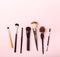 Set of brushes for make up on pink background. Women`s secrets