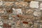 Set chaotic weathered beige gray stones limestone brick cemented cement sturdy base close-up