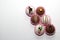 Set of chocolate bombs, marshmallow filling and white chocolate on white background