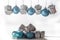 set of christmas ornaments in silver and blue, on white background