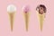 Set of classic flavor ice cream cones in waffle cone - white, pink, brown with chocolate sauce on pink background.