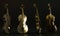 set of classic golden violins isolated on dark background,