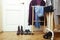 Set of clothers and shoes in flat hanging on rail, modern girl casual wardrobe concept