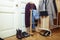 Set of clothers and shoes in flat hanging on rail, modern girl casual wardrobe concept