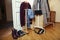 Set of clothers and shoes in flat hanging on rail, modern girl casual wardrobe concept