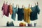 a set of clotheslines, each with a different kind of clothing hanging