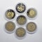 A set of collection coins of Ukrainian hryvnia of different denominations made in gold color.