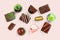 Set of coloful luxury handmade bonbons on pink background. Exclusive chocolate candies