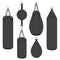 Set of color illustrations with a black punching bag, boxing pears. Isolated vector objects.