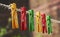 A set of colored green, red and yellow wooden pegs on a vintage string