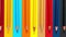 A set of colored pencils on a colorful background. Group of colored wooden