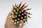 A set of colored pencils in the form of a bouquet, holding in your hand