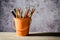 A set of colored pencils on a toy bucket in a beautiful brownish background