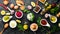 Set of colored sauces and spices on black stone background.