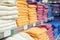 A set of colored towels on a shelf in a store.