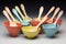 set of colorful baby spoons and bowls