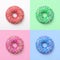 Set of colorful donuts in icing on a colored background. Excellent fresh delicious purple green blue pink donut in icing. Collage