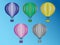 A set of colorful hot air balloons flying in the sky